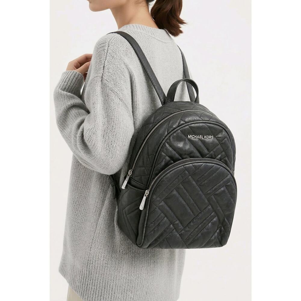 Michael Kors Abbey black quilted backpack.